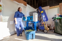 Olympia Yarger and Chris Stevenson obverse foddering waste collected from supermarkets brought to GoTerra facilities in Canberra, Australia.