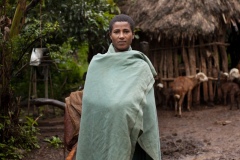 Balaynesh Kasa 27, a female farmer and beneficiary of the Debre Yacob Learning Watershed Restoration Project in Bahir Dar, Ethiopia. Photographed with her avocado trees, animals, beehives and waterpump and her 4 children
Eyrus 12, Ambtebal 9, Berekt 6 and Asmara 1 and a half yrs.
She says, “What we got from the project was the plants - 8 years ago, banana plants, avocado plants and hops
Before we had nothing.
When the project supported us we got all this benefit, for example the bananes, the kids eat them and I can sell them in the market, the hops I sell and I buy all the merchandise for the house like coffee, pepper, onions, oil, salt, meat, clothes for the kids, I can buy Medicines when they are sick, i buy all this just by selling the hops. In the past we struggled a lot. Now I can support my family and spend time with my kids (before I was sat in the market every day as a small trader) and I am so happy with this support, it has changed my life and I am so happy. All my kids can go to school now whereas before I might only have been able to send one. I would love my kids to be doctors and go further than I did.
I also have a beehive and a water pump.”