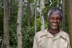 Cheklu Fente 59, Head of Watershed assembly committee and beneficiary of The Debre Yacob Watershed Learning Restoration Project in Bahir Dar, Ethiopia.
He says, “ I have been involved and leader of the committee for 6 yrs now, We do many things
1. To protect over grazing
2. To protect the plantation from being cut
3. Environmental protection, like maintaining the flow of water in the gulleys
4. Forestation plantation
5. Controlling the nursery area
6. We meet once a mont

We are volunteers, we don’t get paid. This area was damaged, when I was a kid, this area was covered by forest, then by the time I grew up it was gone, cut down, now it has been restored by the help of this project and the government.
I give free service to avoid water shortage, to stop the damage, water used to be scarce and now we can have easy access to water and can benefit from the grass and planting and tomorrow we can benefit from the trees. In this watershed area all of us are benefitting, and the future generation can benefit too. We don’t want to repeat our father’s mistakes.
My first success and happiness is that when I used to walk the land it was like walking on chilli powder, it was nothing, now I have this beauty to look at.
I’m very happy, I feel like I understand the environment now, there are 80 below me on the committee, and now we have to elect next person and find the right person to carry on this good work.
I am so proud of this, this is a global thing, A global problem and we have made a success of our area, i believe this will last forever .
Now I think deforestation is a huge problem for our world, We are leaders in this here, finding solutions and showing that they can work.”