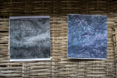 Farmers looks at sattelite images printout of Kanji village before CFR rights 2009 &amp; after CFR rights in 2017  to see how their villages forest cover is improved after their practices after the village meeting in Sagai village.