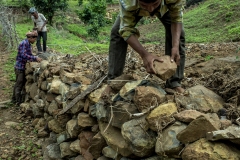 Men works on farm bunding in the fields of Sagai forest villages in Narmada district in Gujrat.