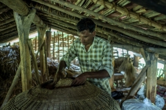 Amirbhai from Kanji village with his stored rice grains at his house in Sagai forest in Narmada district in Gujrat.