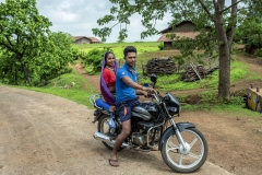 Rakeshbhai with his mother in law on motorcycle in Dabaka village in Sagai forest in Narmada district in Gujarat. Motorcylcles are new addition to the status of the farmers after thier CFR rights where they started benfitting.