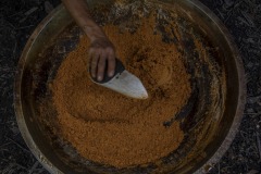 A farmer traditionally process sugar palm juice taken from a sugar palm tree into palm sugar at a forest in Sintang regency, West Kalimantan, Indonesia.