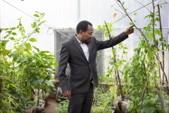 Dr Birhanu, age 39, Research Directorate Director at Gullele Botantical Gardens, Addis Ababa, Ethiopia. Photographed with Commiphora Monoiccao - critically endangered - “every plant has its own importance, every one is ecologically important- inside this plant is an oil that is used to treat wounds.”“My degree is biology, I studied in Bahir Dar - I used to go to swim in blue mile river, collecting wood, have a close relationship with nature - and my interest just grew as I studied - most people in Ethiopia are very passionate about plants - the old people love plants - plants are everything for us - food, medicine, household implements, farming implements, building, they are everything it is an agricultural country, not an industrialised country , they cut plants because they don’t have options.  We aim to preserve and protect and grow plants to sell in the nurseries for the communities”