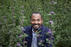 Dr Hiyab - 34 Vice Director for Research at The Gullele Botantical Gardens, Addis Ababa, Ethiopia with a Purple fragrant - lipid adoensis.