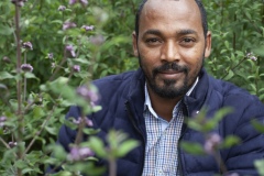 Dr Hiyab - 34 Vice Director for Research at The Gullele Botantical Gardens, Addis Ababa, Ethiopia with a Purple fragrant - lipid adoensis.